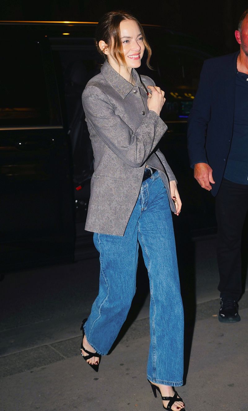 Emma Stone wearing a jacquard jacket and jeans in Paris
