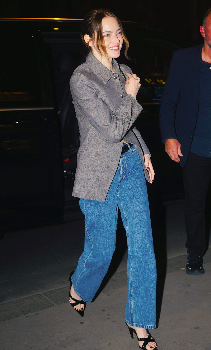 Emma Stone wearing a jacquard jacket and jeans in Paris