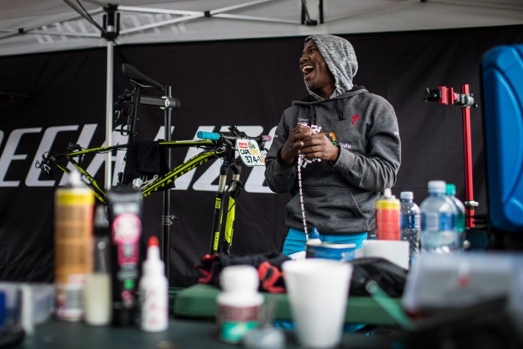 A mechanic enjoys a laugh at stage 6
