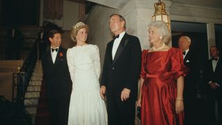 From left to right, Prince Charles and Diana, Princess of Wales (1961 - 1997) with US Vice President George Bush and his wife Barbara during a dinner at the British Embassy in Washington, DC, November 1985. Diana is wearing an evening dress by Murray Arbeid and the Queen Mary tiara.