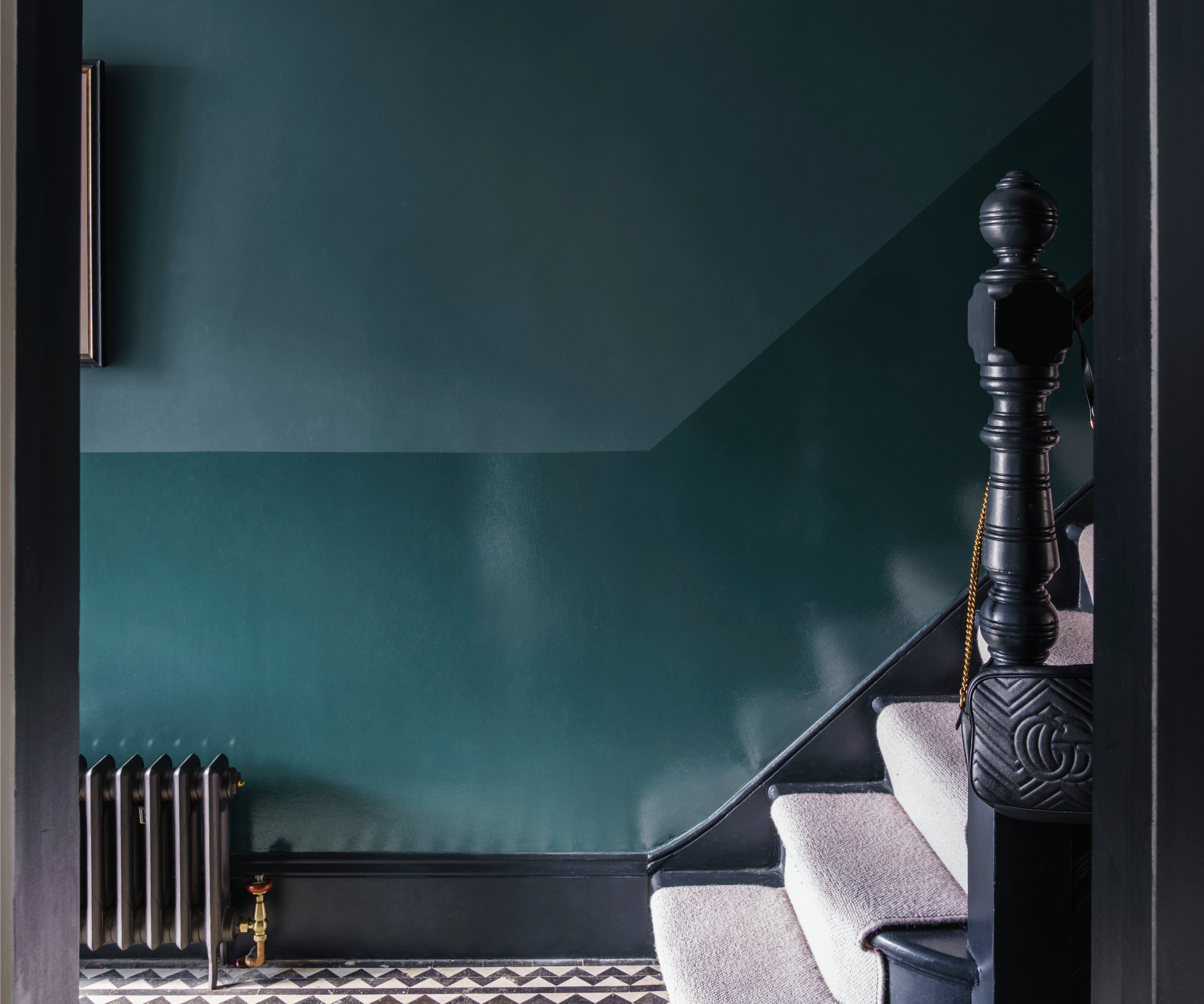 A stairwell with contrast colour paintwork, separated by a crisp line created using masking tape