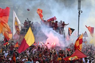 Roma's players celebrate with fans in the Italian capital after winning the UEFA Conference League in 2022.