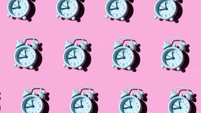 tiny blue clocks in three rows with pink background