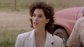 Dr. Melissa Reeves (Jami Gertz) listens to an explanation in Twister