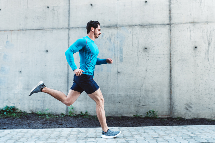 Man running down the sidewalk