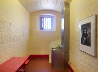 Room with brick wall at Reading Prison