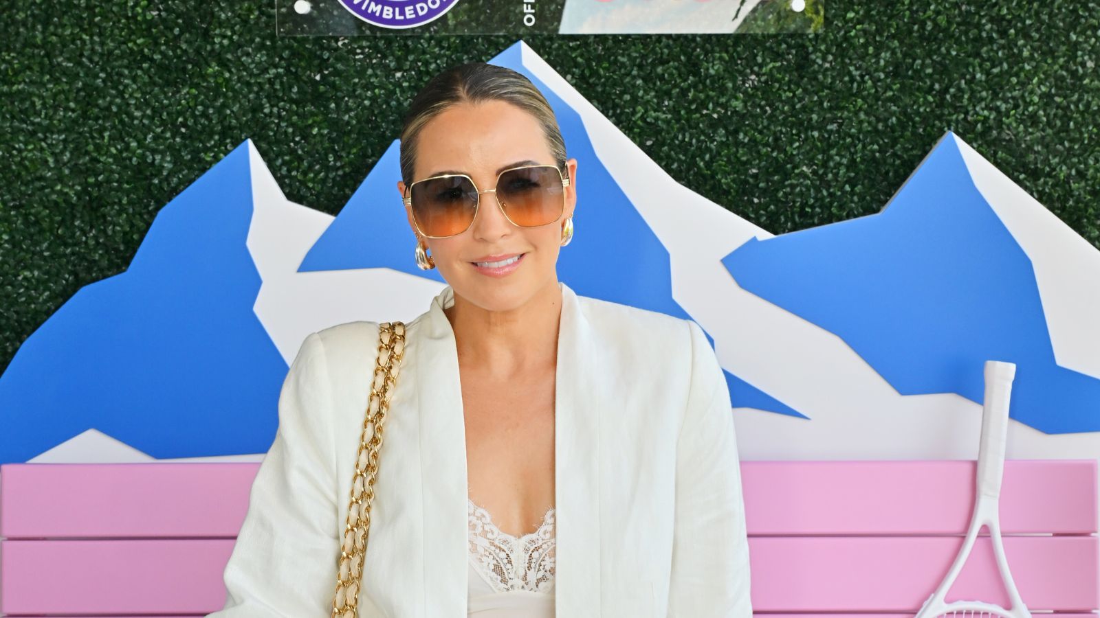 Rachel Stevens in big sunglasses and a white blazer