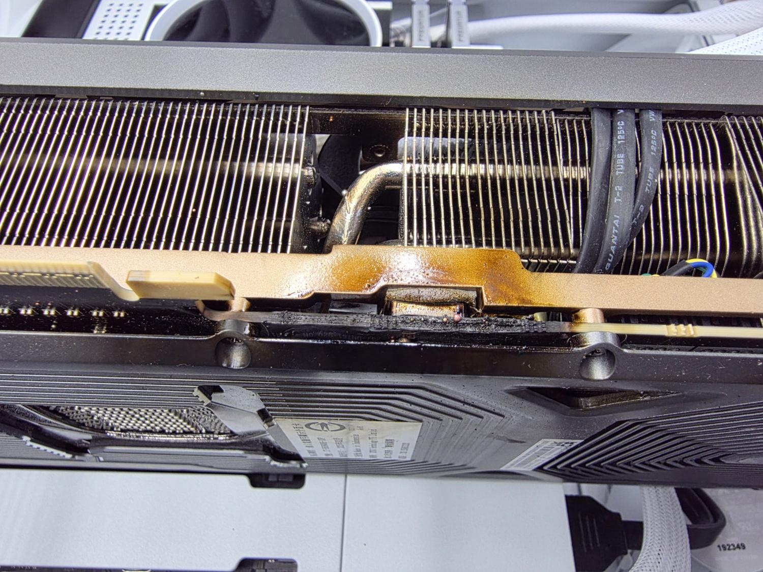 An RTX 5090 that caught fire and also left burnt marks on the motherboard, SSD AIO cooler and RAM