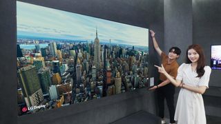 LG 97-inch OLED.EX TV being demonstrated at a trade show