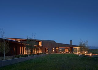 Illuminated from within at dusk, Black Fox Ranch, CLB Architects