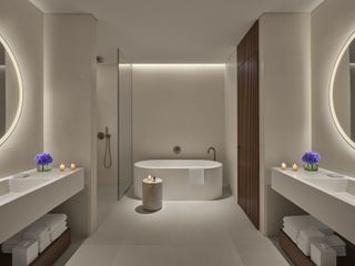 white minimalist bathroom with lit candles