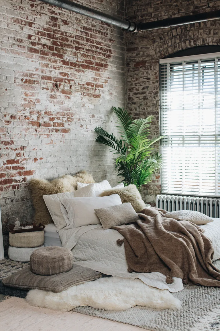 zen corner in living room with low sofa and cushions