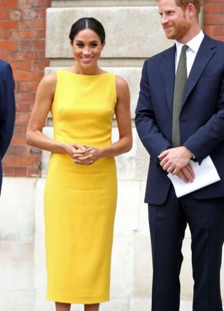 Britain's Prince Harry, Duke of Sussex (R), Britain's Meghan, Duchess of Sussex arrive to attend a reception marking the culmination of the Commonwealth Secretariats Youth Leadership Workshop, at Marlborough House in London on July 5, 2018