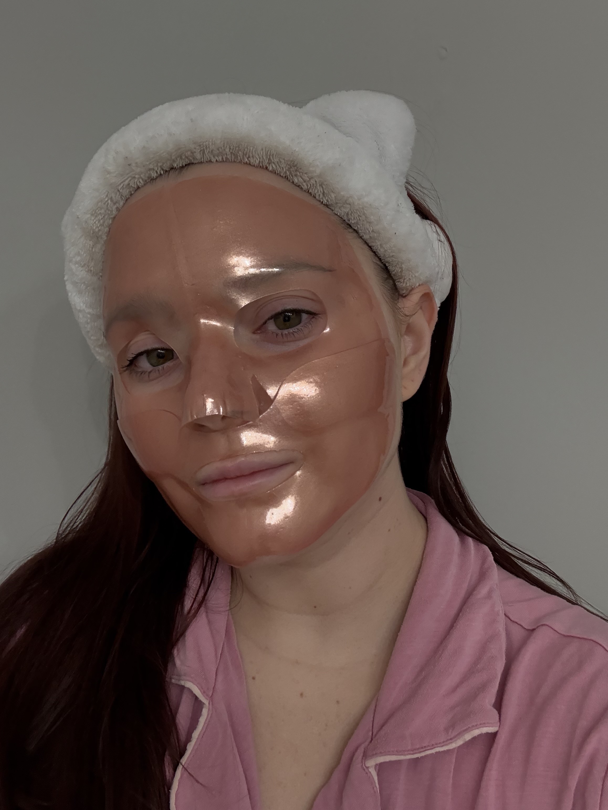 girl with white headband and a rose gold face mask