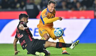 Osvaldo Rodríguez of Tigres challenges Diego Barbosa of Toluca during the match between Tigres UANL and Toluca in the Torneo Clausura 2026 Liga MX at Universitario Stadium in Monterrey, Mexico