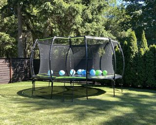 15ft trampoline in a garden in summer
