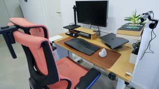 An ErgoTune Supreme V3 chair in front of a fully setup EverDesk Max