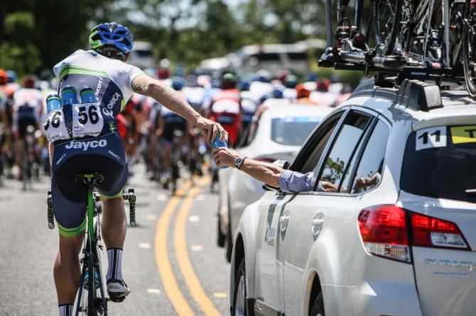 An Orica GreenEdge rider loads up on bottles