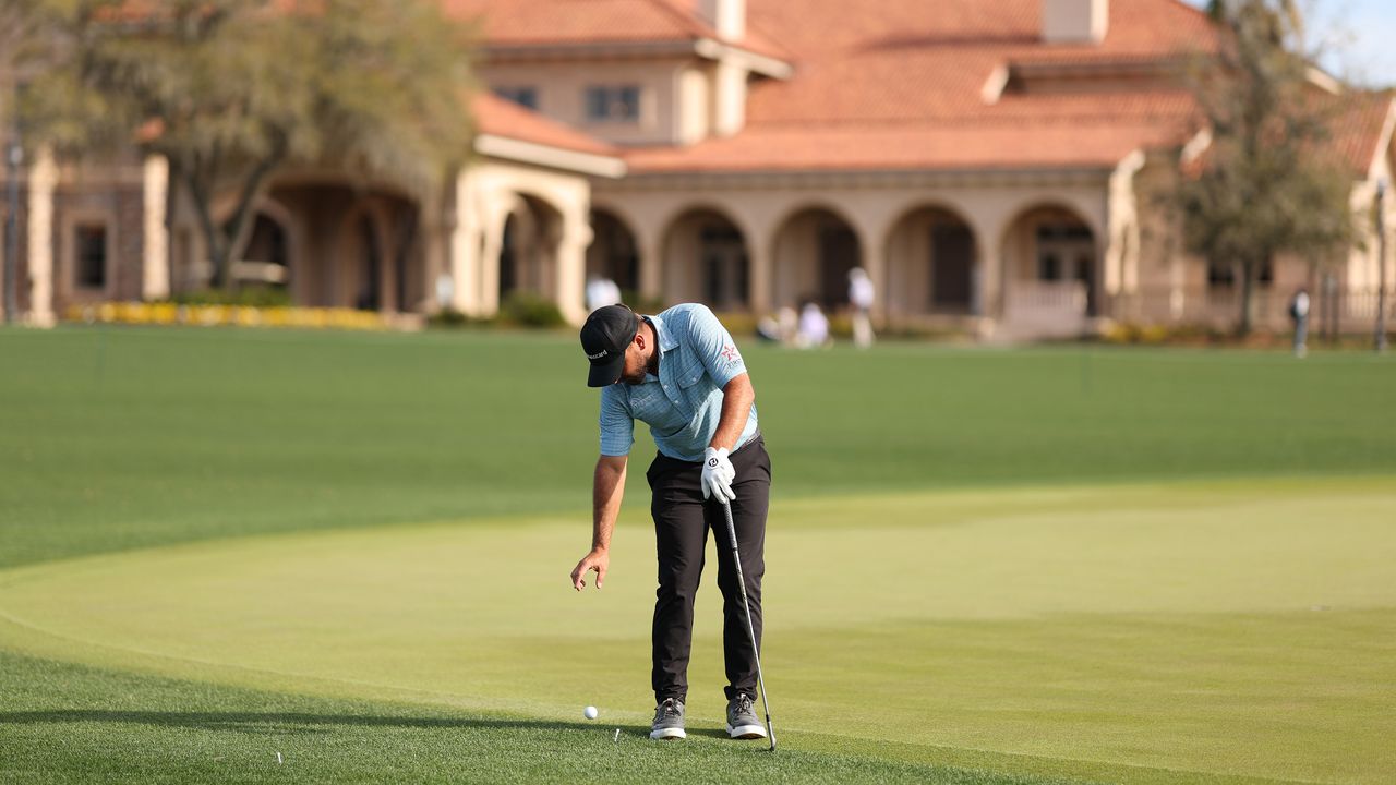 Player dropping a golf ball