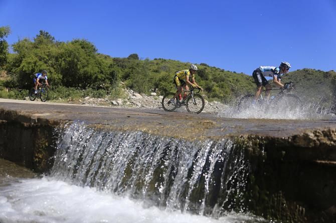 The peloton crosses a stream mid-route in Tour de San Luis