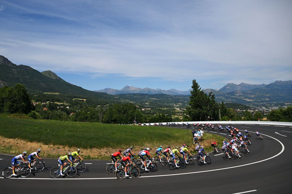SUPERDEVOLUY LE DEVOLUY FRANCE JULY 17 LR Fabien Grellier of France and Team TotalEnergies Kobe Goossens of Belgium and Team Intermarche Wanty Clement Champoussin of France and Team Arkea BB Hotels Kevin Geniets of Luxembourg and Team Groupama FDJ and a general view of the peloton competing during the 111th Tour de France 2024 Stage 17 a 1778km stage from SaintPaulTroisChateaux to Superdevoluy 1500m UCIWT on July 17 2024 in Superdevoluy Le Devoluy France Photo by Tim de WaeleGetty Images