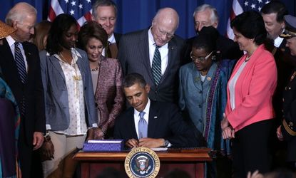 President Obama signs the Violence Against Women Act, a opposed by 22 Republican senators.