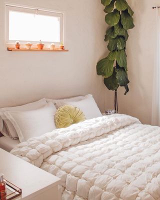 urbanoutfitters minimalistic bedroom with white popcorn comforter