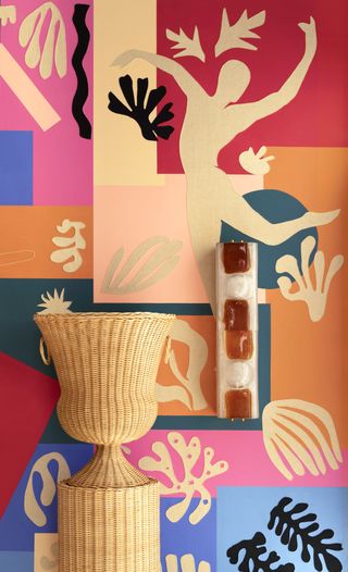 Colourful wallpaper with human figure and plant silhouettes
