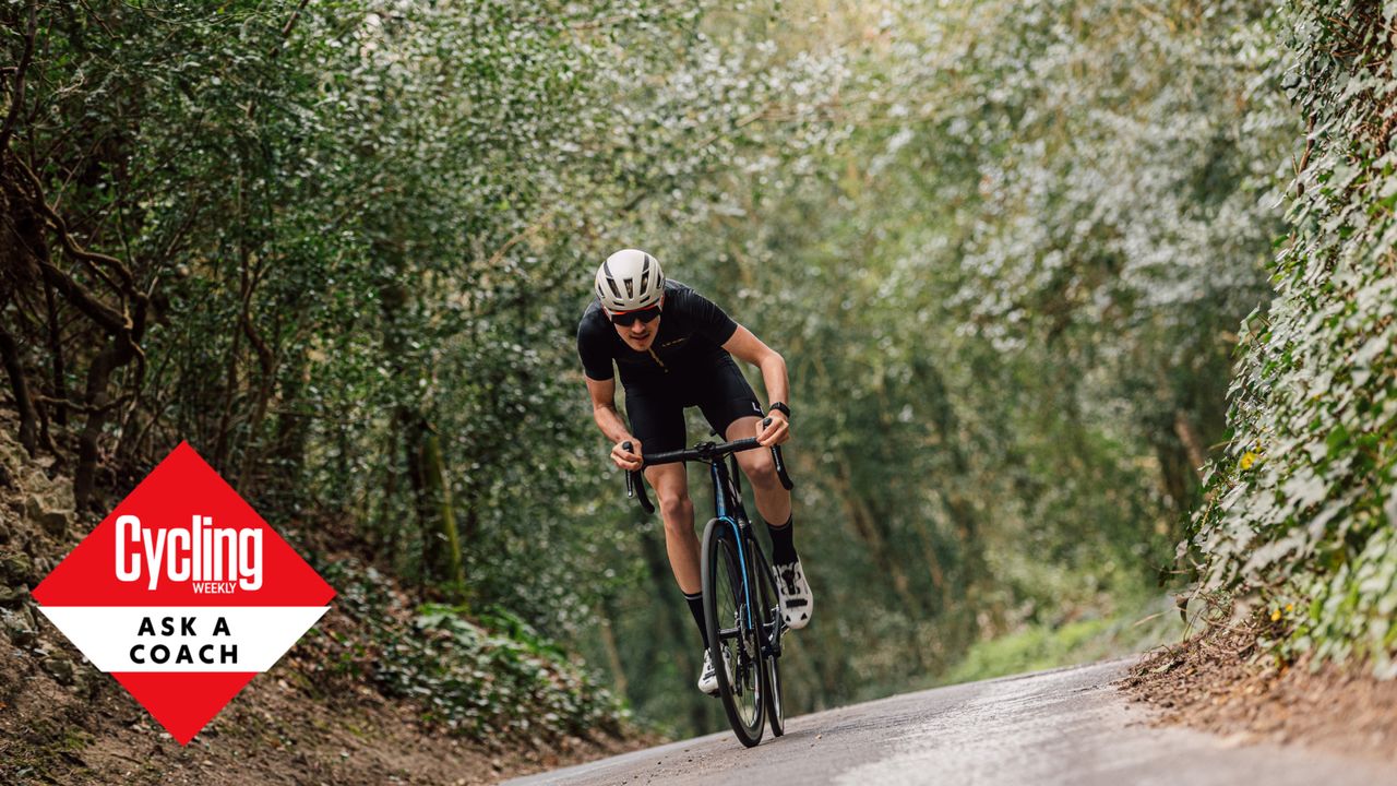 Male cyclist sprinting as hard as he can outside to produce his max power in cycling