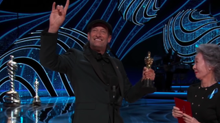 Troy Kotsur accepting his Oscar for Best Supporting Actor CODA at the 2022 Academy Awards