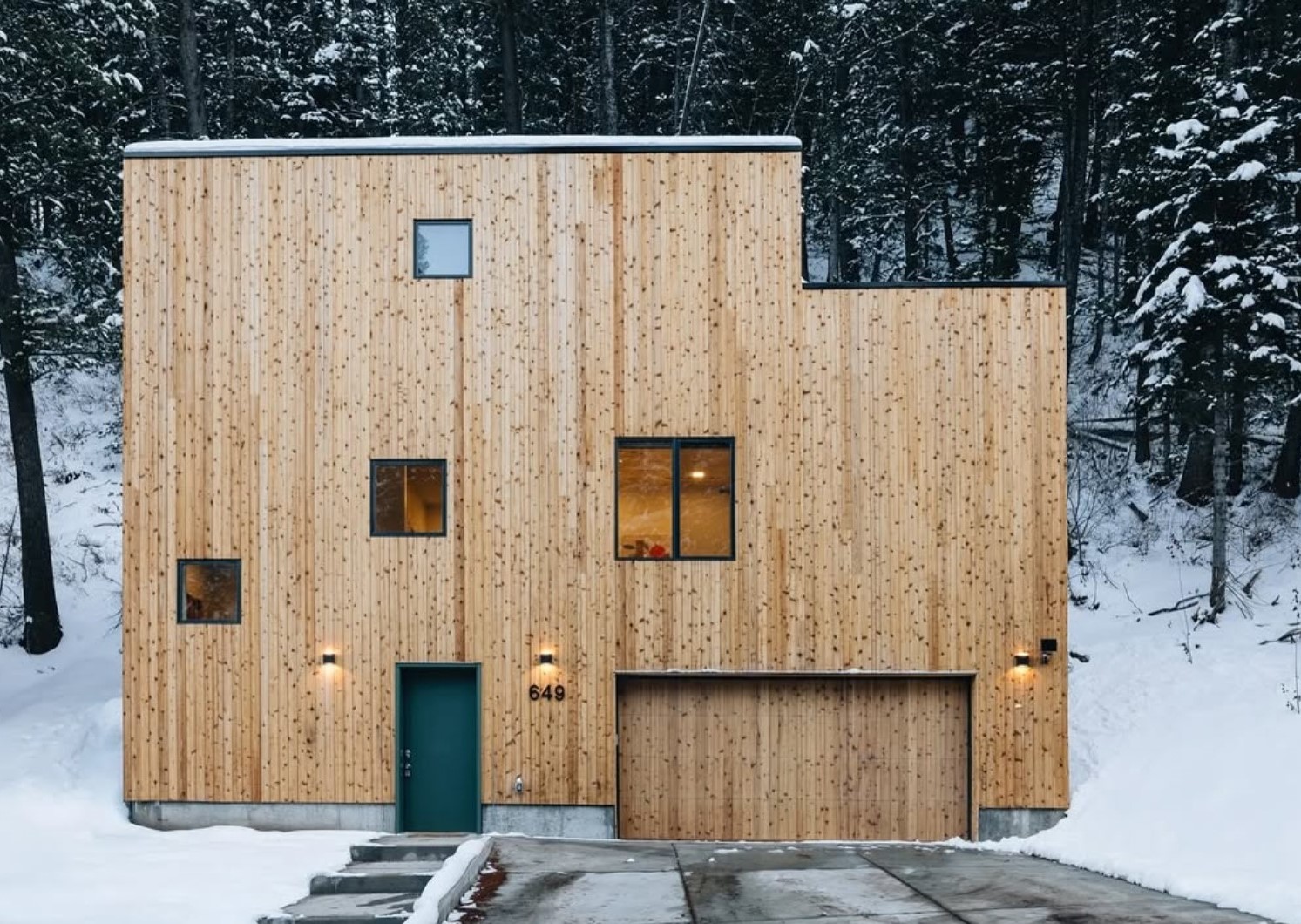 Parkview Mountain House by Mattaforma, a wooden house in a forest, snowy views