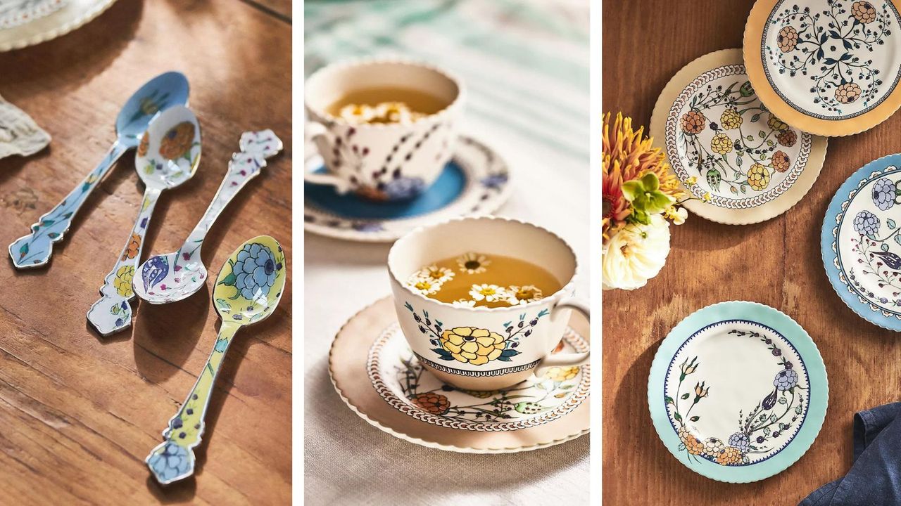 Items from the Anthropologie Turkuaz Kitchen line including paisley teaspoons, teacups, and plates, on a wooden table and a light-colored tablecloth