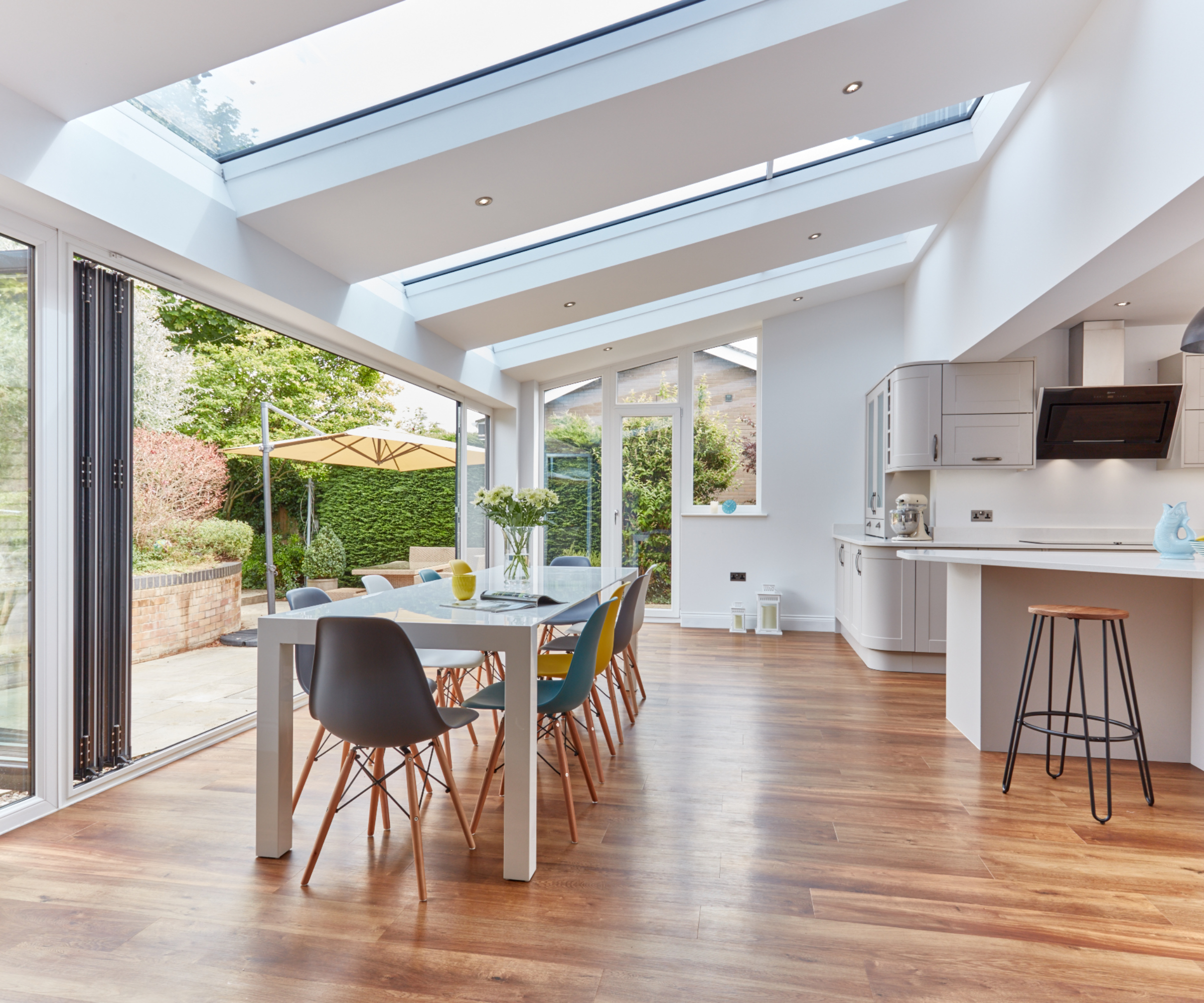 inside of conservatory dining space with roof made of solid sections and glazed panels