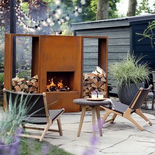 outdoor fireplace with group of chairs