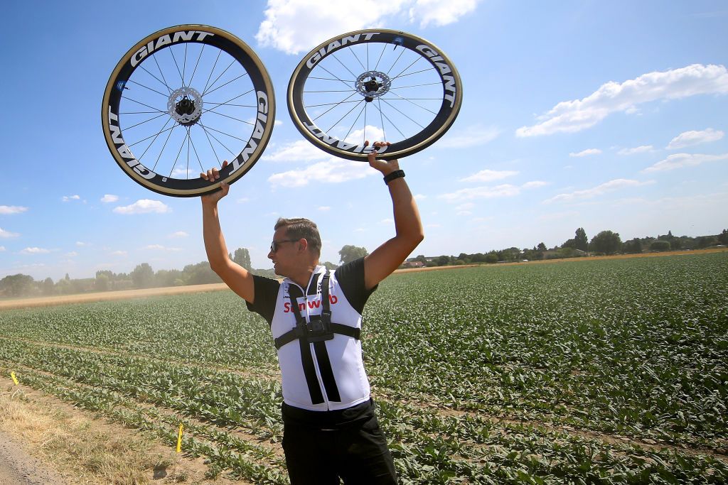 A Sunweb mechanic ready for wheel changes