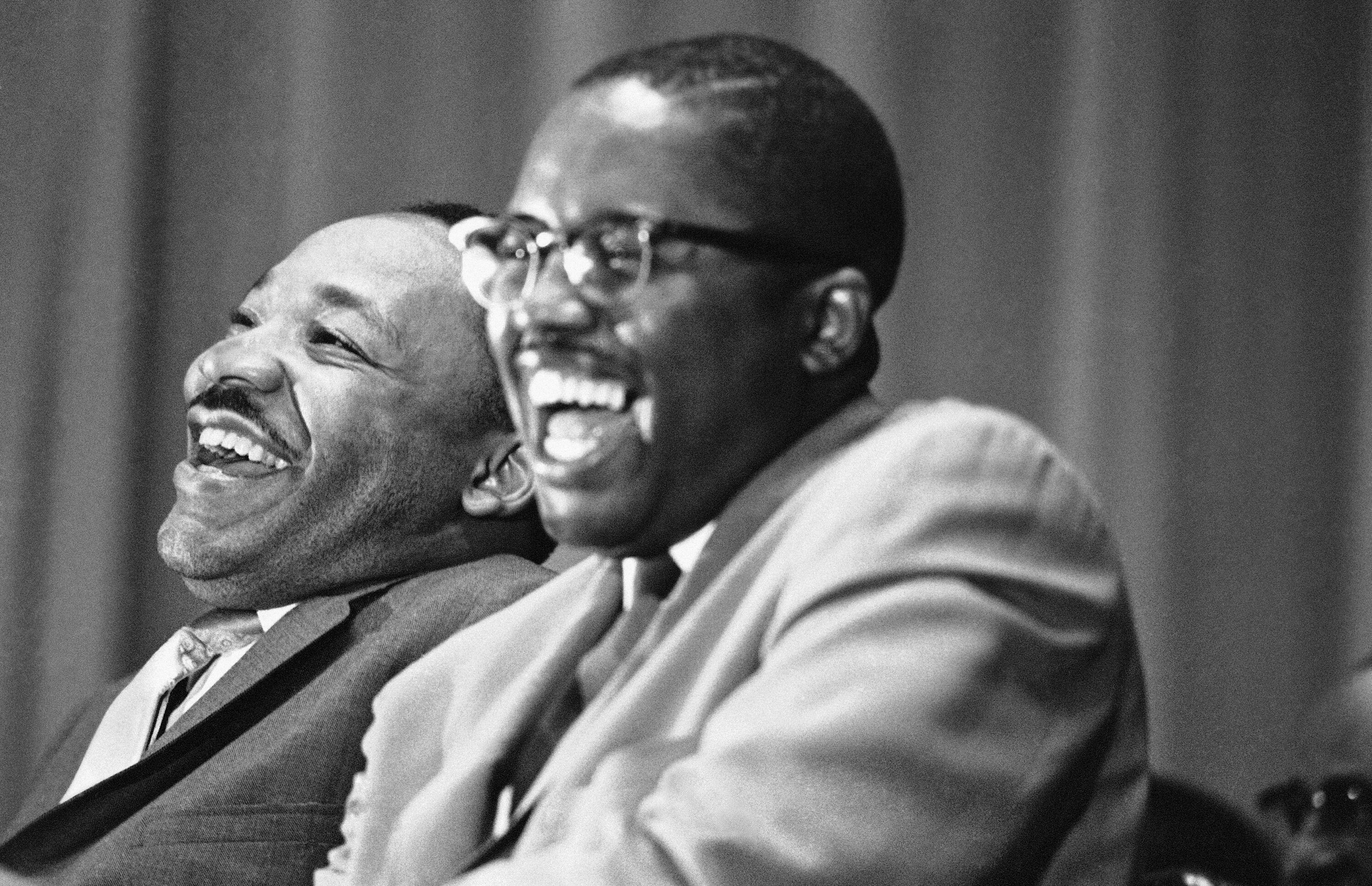 2NCYR47 Civil rights leader Martin Luther King Jr., left, and Tuskegee attorney Fred Gray break into laughter at a joke told by a speaker at a political rally in Tuskegee, Alabama, April 29, 1966. Rev. King is on a whistle-stop tour through Alabama to encourage block-voting by blacks in the May 3 Alabama primary. Gray is a candidate for a seat in the Alabama House of Representatives. (AP Photo/Jack Thornell)
