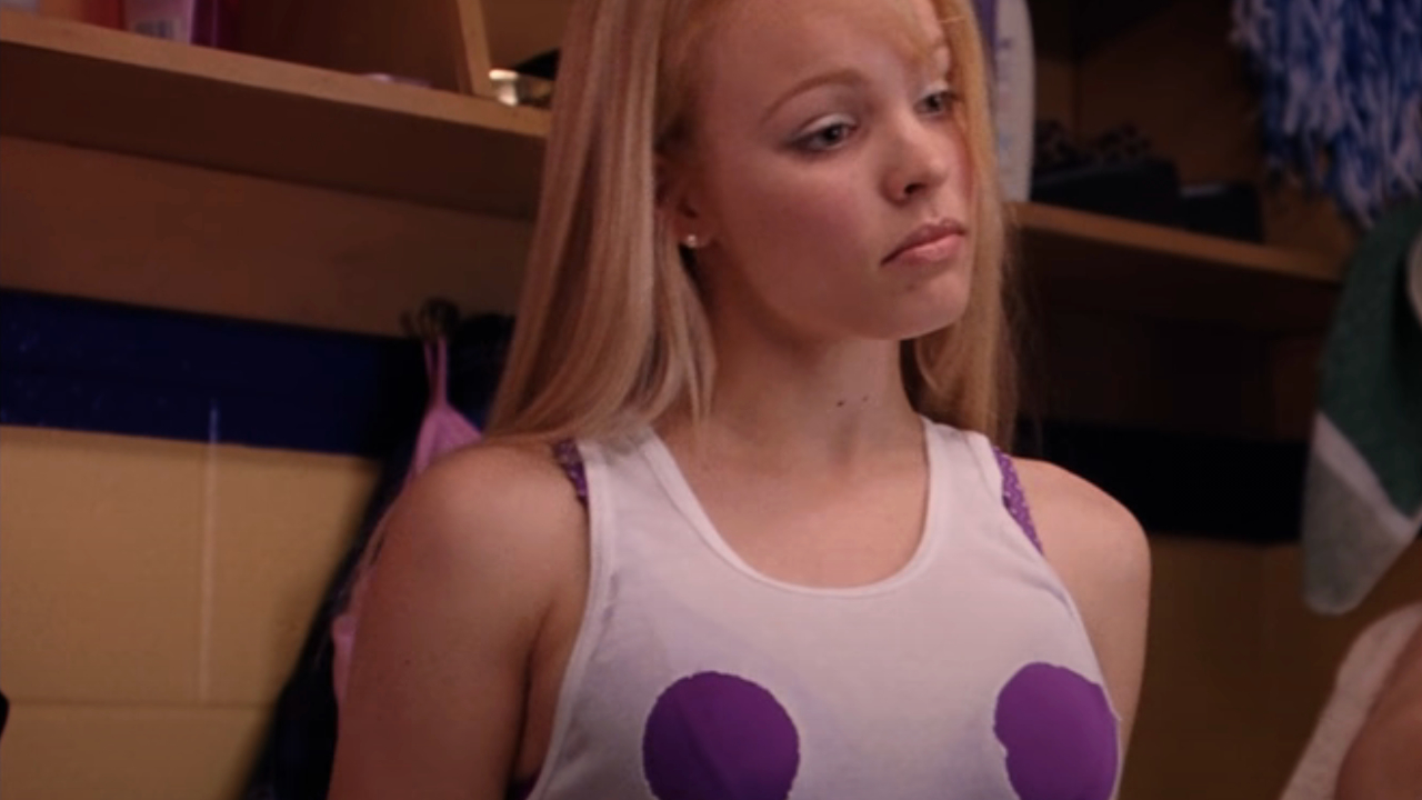 Rachel McAdams wears a defaced tank top casually in Mean Girls.