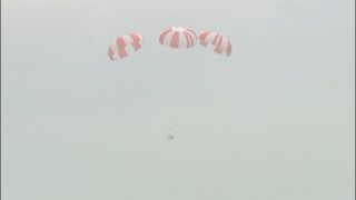 SpaceX's Dragon crew capsule safely parachuted back to Earth after a successful test of the launch escape system on May 6, 2015.