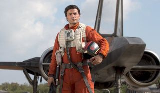 Poe Dameron standing in front of X-Wing