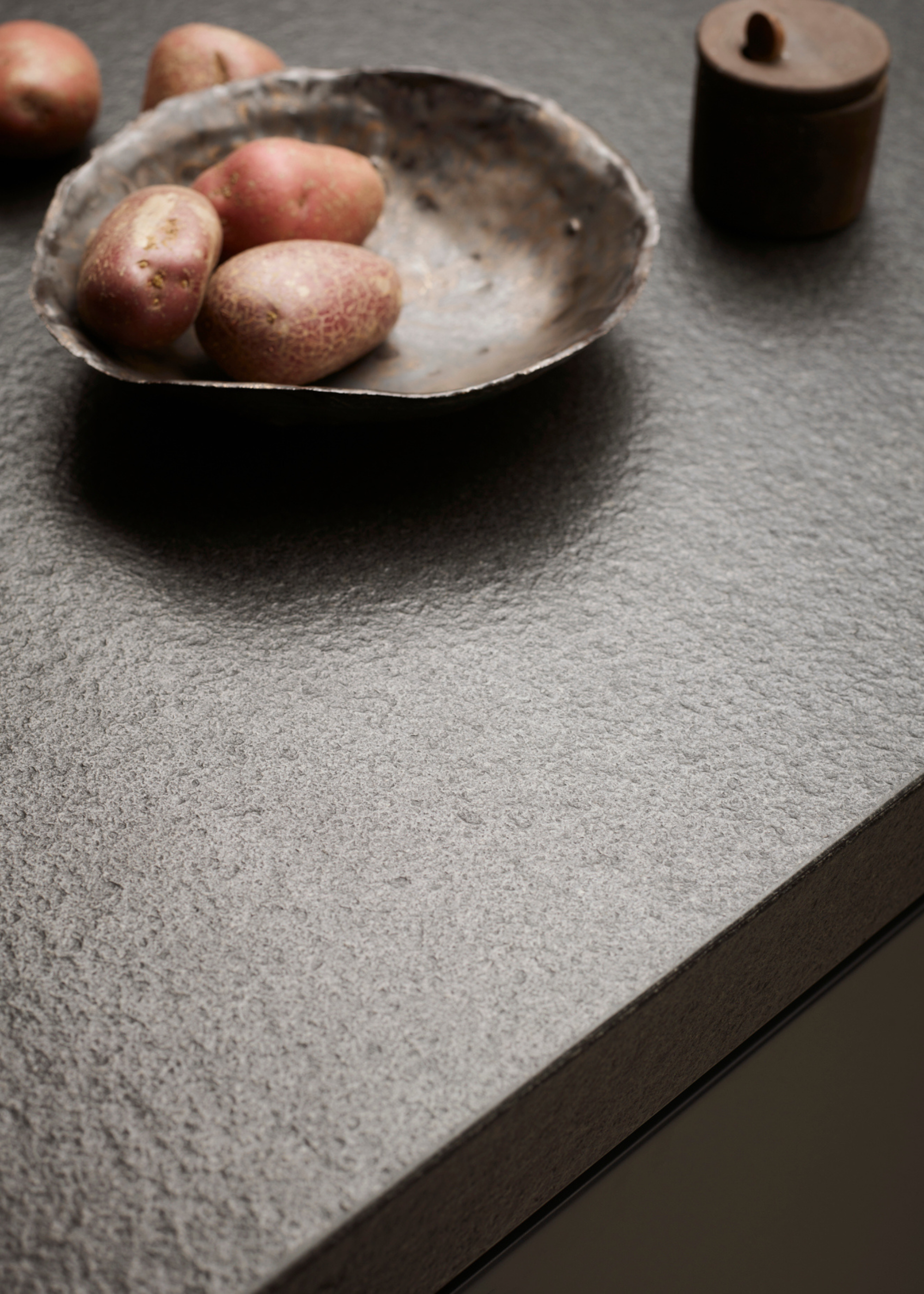 close up of the textured graphite kitchen island countertop material
