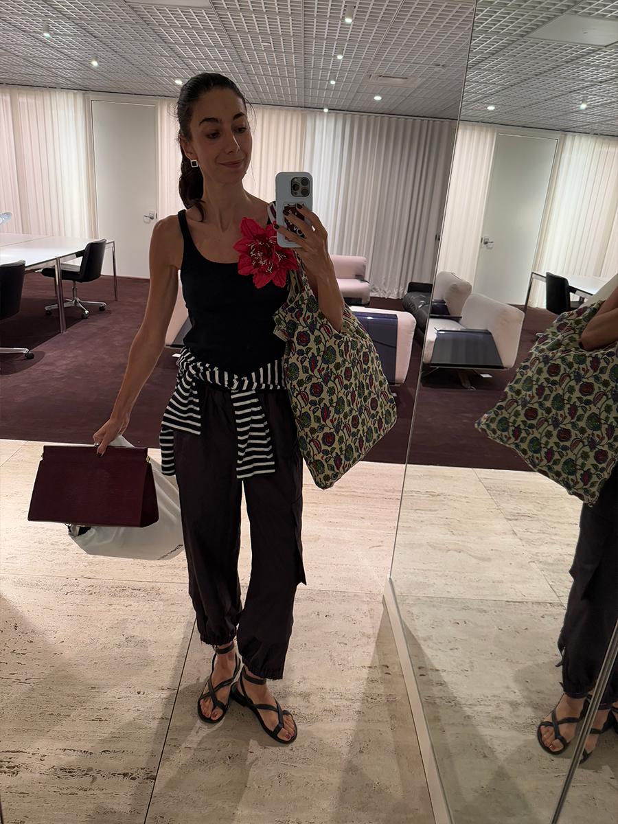 melanie masarin ghia style outfits wearing flower pin and tibi pants