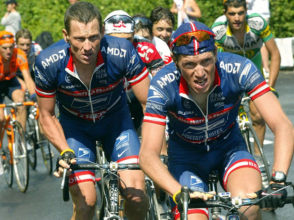 Lance Armstrong (US Postal) rides beghind his Portuguese teammate Jose Azevedo during the 12th stage of the 2004 Tour de France between Castelsarrasin and La Mongie