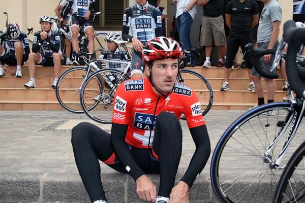 Cancellara adjusts his shoes.