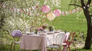 garden party ideas with colourful paper lanterns hanging in trees