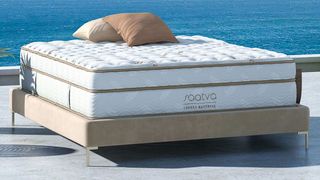 photo of the Saatva Classic Mattress on a patio by the sea