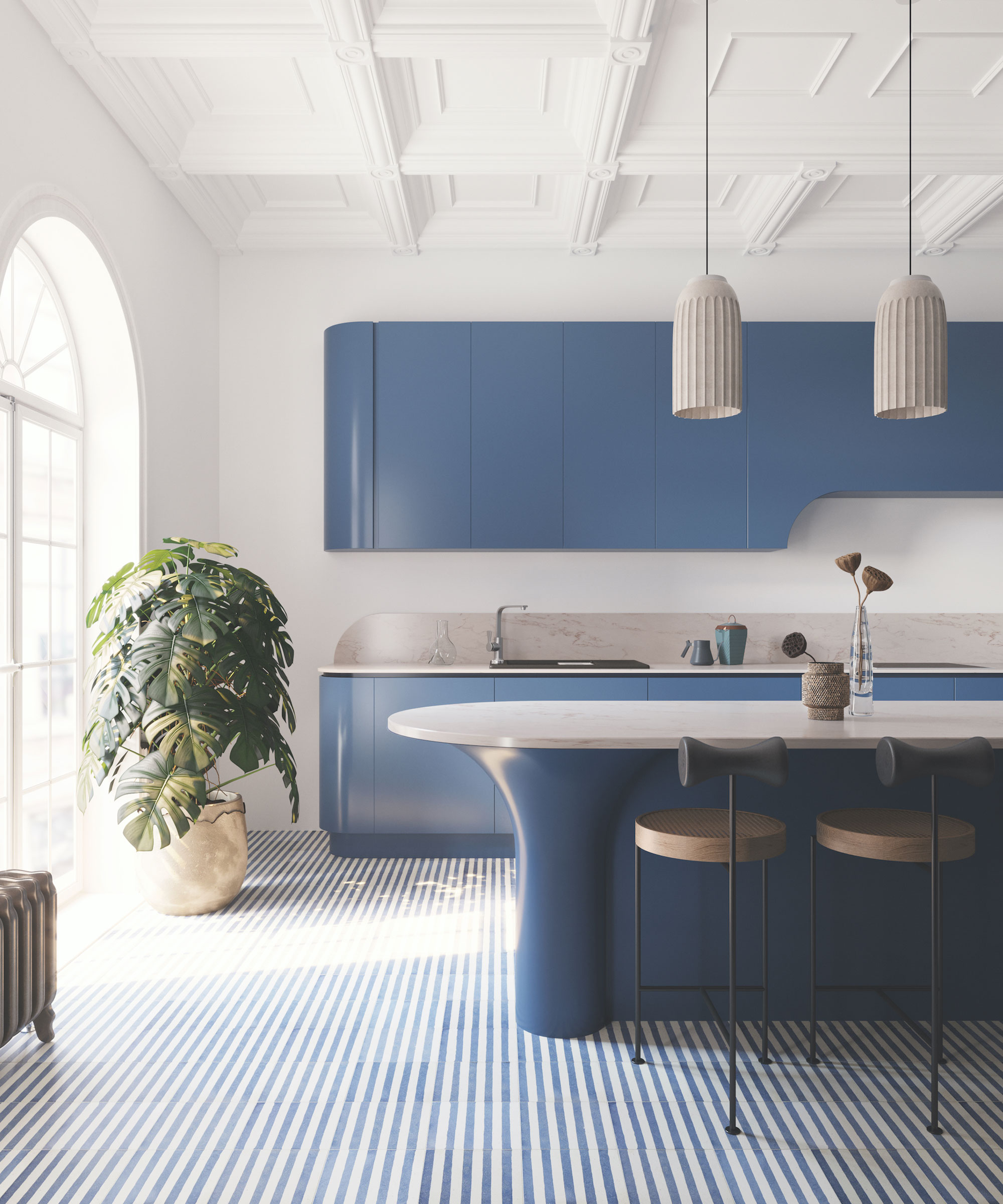 Contemporary kitchen space with blue striped tiled flooring, blue kitchen cabinets, oval shaped kitchen island with marble countertop, black and light wood counter chairs, large green plant in basket, two pendants hanging above island