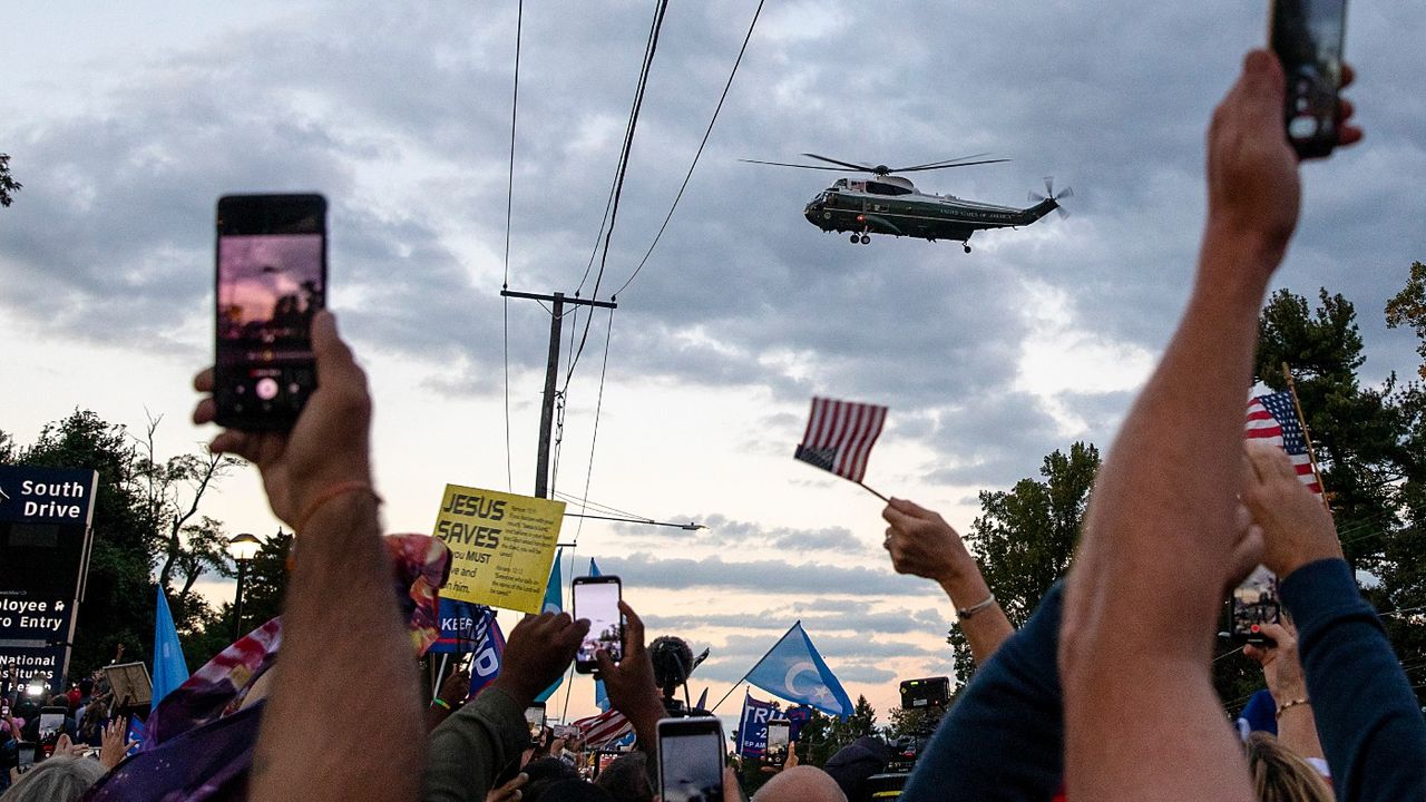 Trump leaves Walter Reed military hospital in Marine One.