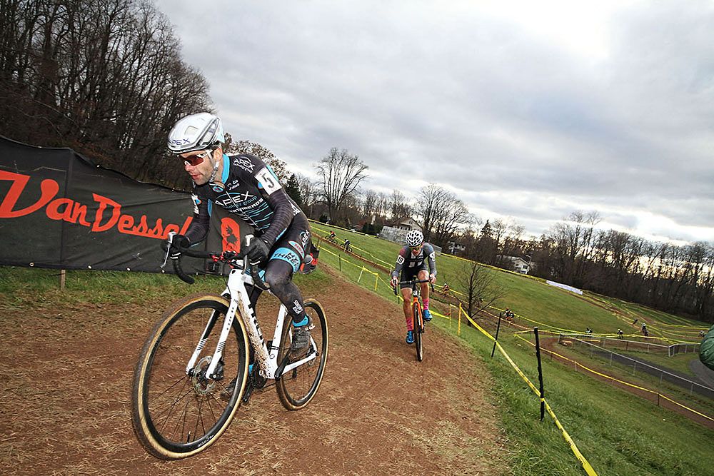 Riders navigate a tricky off-camber turn