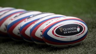 Guinness branded rugby balls on the pitch