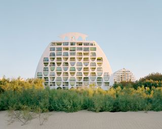 La Cité Oasis, a photographic series on La Grande Motte, shot by Charly Broyez & Laurent Kronental and showing sculptural, white and geometric modernist architecture in the south of france, surrounded by green spaces and in monumental scale